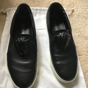 Men’s black Versace slip-on sneakers